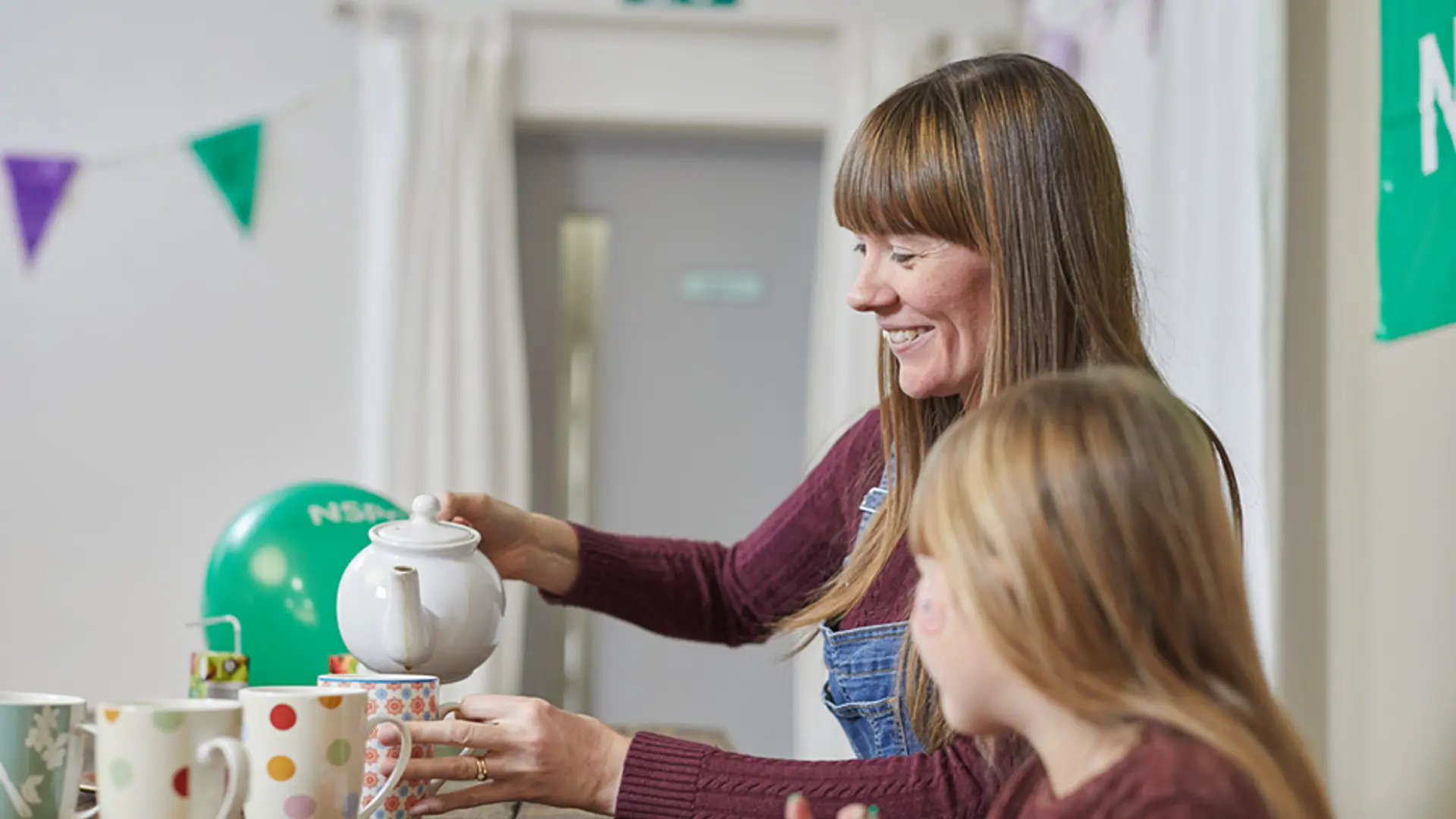 NSPCC volunteer making refreshments at an event