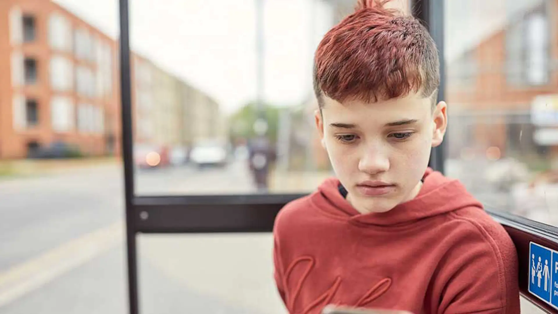 A teenager staring blankly into the distance.